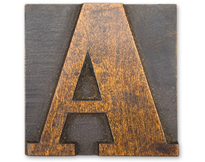 Antique wood cut block of the letter A
