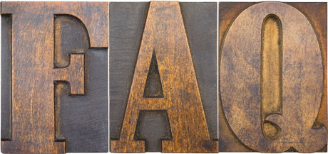Antique wood cut block of the letters F, A, and Q