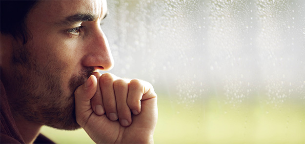 Picture of frustrated couple, back to back, who are in crisis